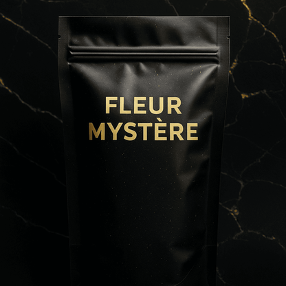 Sachet Mystère CBD noir mat avec texte doré Fleur Mystère, collection Fleurs CBD et Nos Exclusivités, boutique CBD Caen.