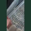 Video de presentation de l'offre promotionnelle 10g plus 10g offert sur les fleurs CBD, main tenant un sachet de fleur CBD Lemon OG 10G avec etiquette orange et jaune marquee CBD Cher Lemon OG 10G au premier plan, nombreux sachets de fleurs CBD en vrac avec etiquettes colorees visibles en arriere-plan, offre speciale achat fleur CBD 10g plus 10g offert, produit CBD legal France taux THC inferieur a 0,3%, promotion fleur CBD pas cher disponible sur cbdpaschre14.fr